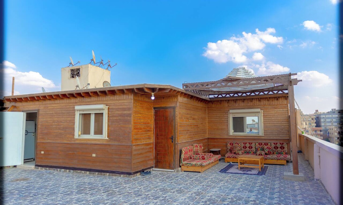 Pyramids Gardens Apartment | Spacious 2-bedroom apartment with Rooftop between GEM and Giza Pyramids