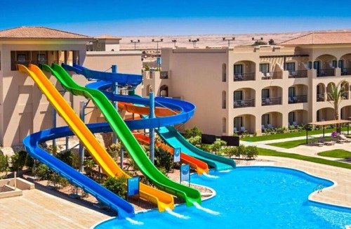 Village Road Resort | Bright & Airy Junior Suite – Lounge, Dressing Room, and Sparkling Pool Views