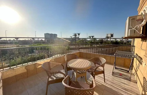 6th of October City Apartment | Elite House: Elegant 3BR Terrace Suite Steps from Mall of Arabia.