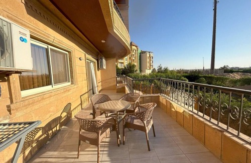 6th of October City Apartment | Elite House: Elegant 3BR Terrace Suite Steps from Mall of Arabia.