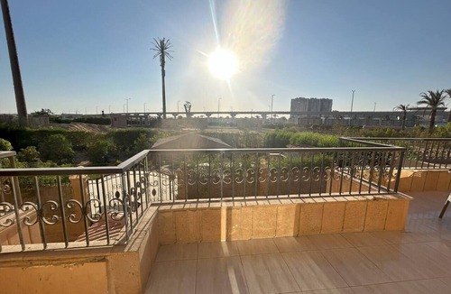 6th of October City Apartment | Elite House: Elegant 3BR Terrace Suite Steps from Mall of Arabia.