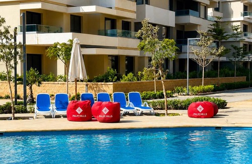 Marina El Alamein Apartment | Hotel-Style, Palm Hills New Alamein, Pool View, Lagoon & Mall Access