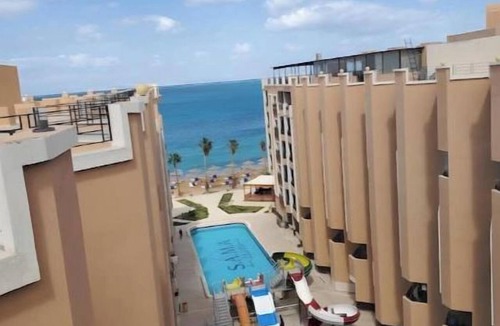 Dahar Apartment | Juliana Sea View 1BR - Beach Access, 2 Pools & Water Slides