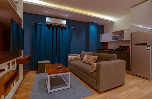 New Cairo Apartment | Modern Studio Near Cairo Airport & Festival City with Garden View