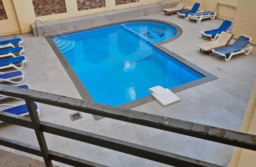 Al Ahyaa Apartment | Quiet Apartment for 4, Pool View Balcony, 3 Min from Beach