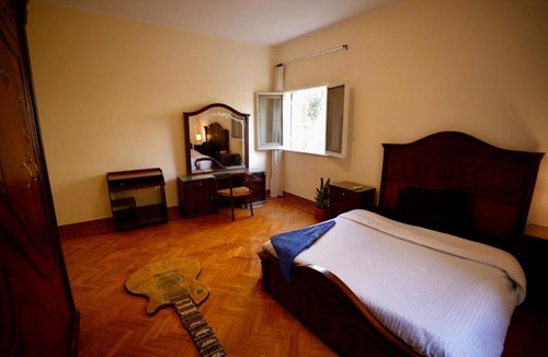 Maadi House | Warm Wooden Bedroom
