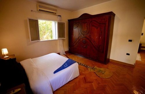 Maadi House | Warm Wooden Bedroom