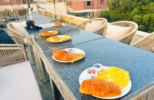 Al Haram House | Watch the Great Pyramids of Giza glow at golden sunset from our rooftop terrace.