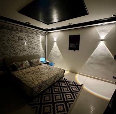 A private room exclusively for men, offering comfort and convenience for a relaxing stay