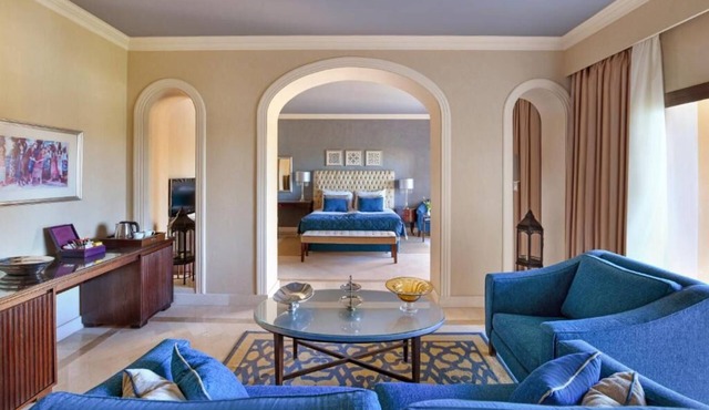 Bright & Airy Junior Suite – Lounge, Dressing Room, and Sparkling Pool Views