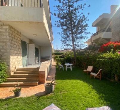 Chalet with Private Garden Green Beach North Coast