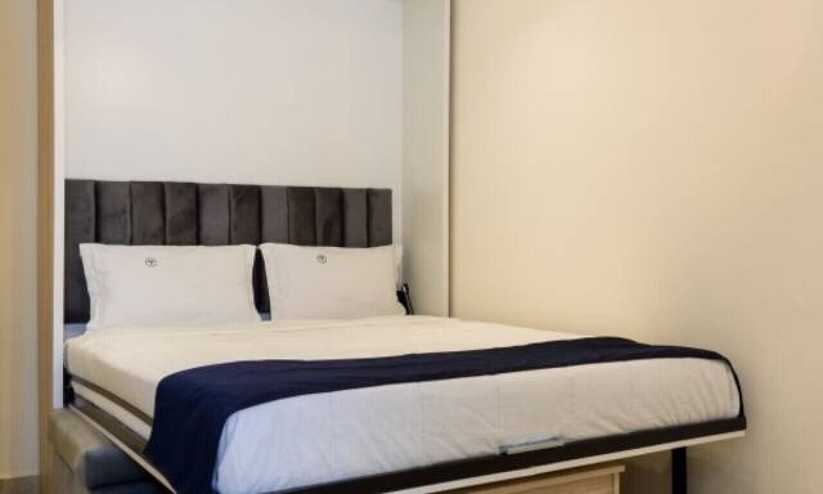 Cairo Apartment | Smart Compact Studio with Convertible Queen Bed , Sofa and Kitchenette and shared community garden