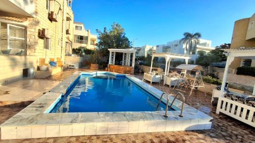 Marina El Alamein Apartment | 2B equipped basement chalet with 2 beds pool view green beach villa 114b