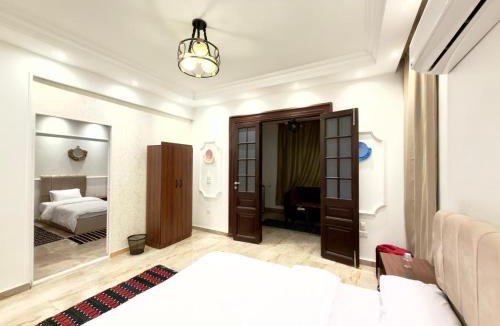 Al Haram House | TriPyramids Suites