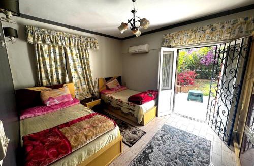 Al-Muntazah Villa | شقة غرفتين نوم بحديقة خاصة في المعمورة الشاطئ دور أرضي